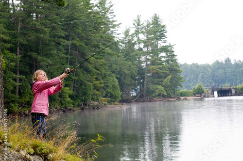 girl fishing at a lake