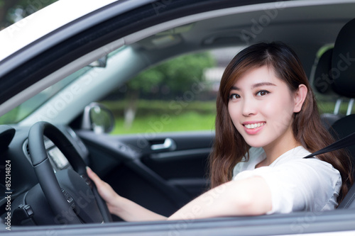 Beautiful young asian woman driving car © zhu difeng