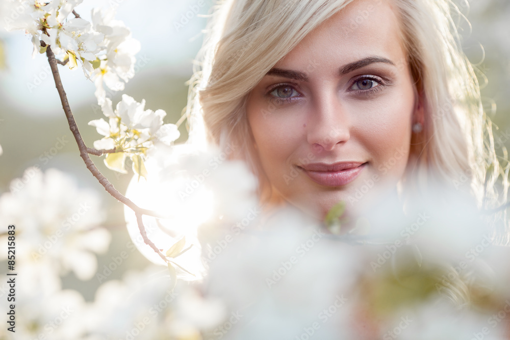 blonde woman in a flowered garden blonde woman in a flowered garden