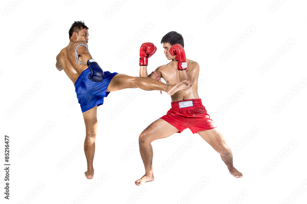 Two thai boxers exercising traditional martial art