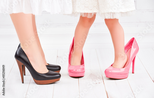 legs mother and daughter little girl fashionista in pink shoes o