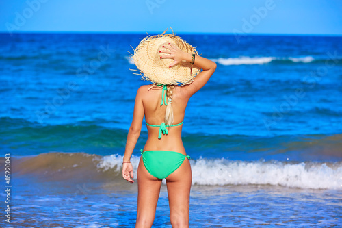 Girl young standing looking at the sea beach hat © lunamarina