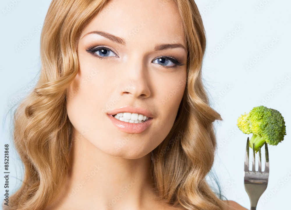 Portrait of young beautiful blond woman with broccoli Portrait of young beautiful blond woman with broccoli
