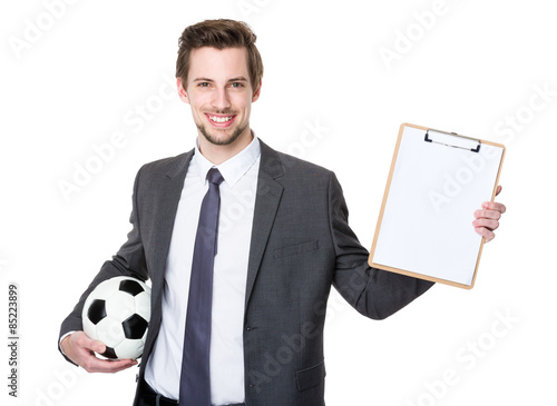 Caucasian scooer manager holding with football and showing with photo