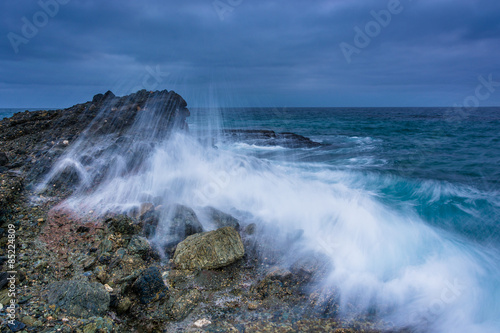 Wave crashing on a rock at Table Rock Beach, in Laguna Beach, Ca