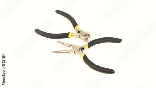 Wire cutters and mini cutters on white, rotation photo