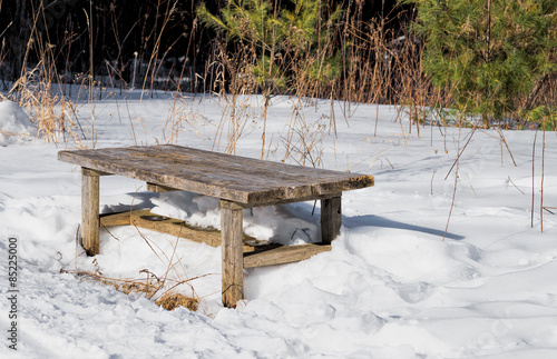 Wooden bench in winter.