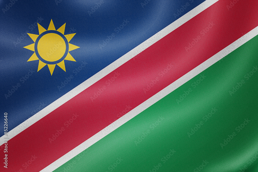Fototapeta premium Namibia flag on the fabric texture background