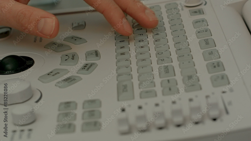 Control panel of medical device with doctor's hand Control panel of medical device with doctor's hand