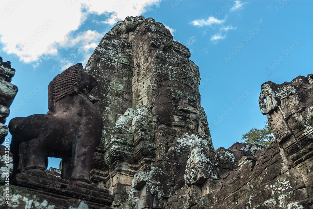 lion and tower like metaphor of the mount meru with the head of lokeshvara and the face of jayavarman VII in the complex of the bayon in the archaeological angkor thom place in siam reap, cambodia lion and tower like metaphor of the mount meru with the head of lokeshvara and the face of jayavarman VII in the complex of the bayon in the archaeological angkor thom place in siam reap, cambodia