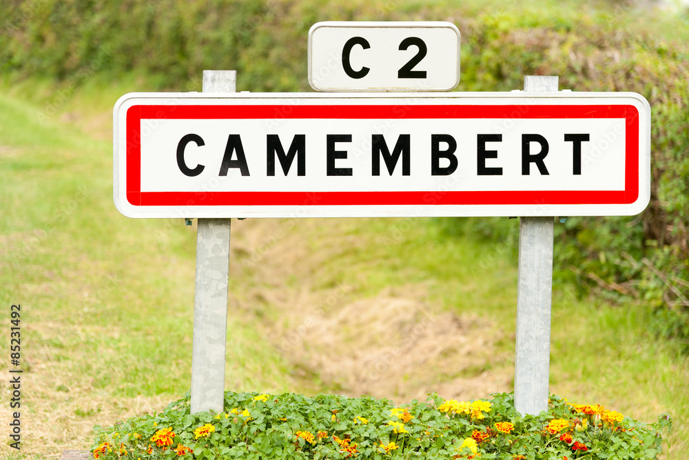 Town sign of the Camembert village, birthplace of famous cheese Town sign of the Camembert village, birthplace of famous cheese