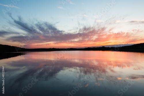 Colorful sunset and reflection at lake © Juhku