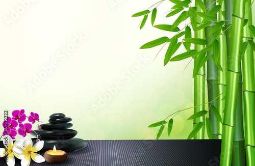Bamboo  stone  flowers and wax background on the table