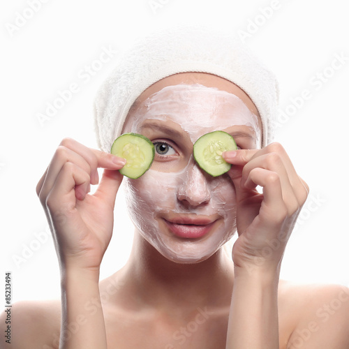 young woman with cucumber mask
