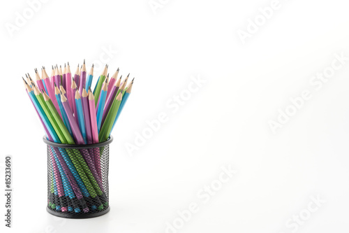 black bucket in office with colorful pencil