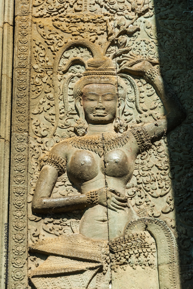 bas-relief of a devata in the archaeological place of angkor wat in siam reap, cambodia
