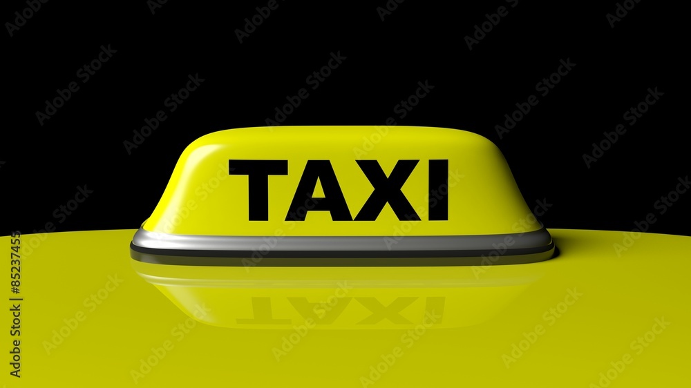 Yellow taxi car roof with sign isolated on black background