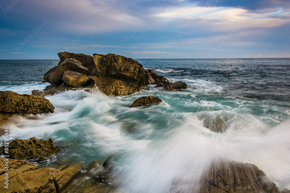 Rocks and waves in the Pacific Ocean at Monument Point, Heisler Park, Laguna Beach, California.