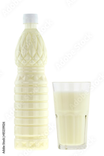 A bottle and a glass of Buttermilk (fermented milk drinks) isolated on white background photo