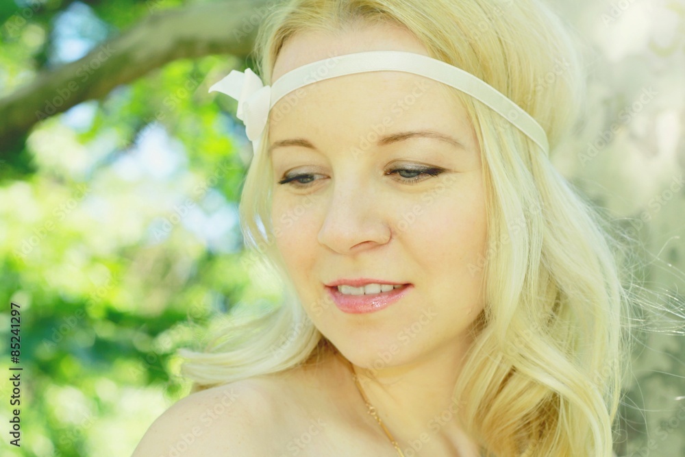 Portrait of beautiful young woman with headband