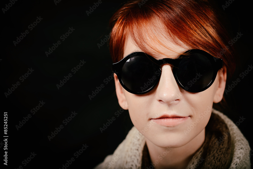 unusual woman studio with red hair and sunglasses unusual woman studio with red hair and sunglasses
