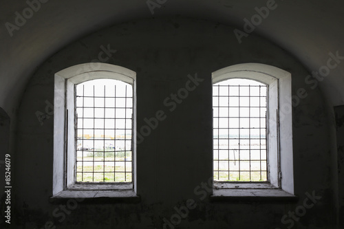two barred Windows in an old fortress from the inside