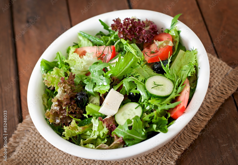 Very useful and diet salad of herbs, vegetables and feta cheese Very useful and diet salad of herbs, vegetables and feta cheese