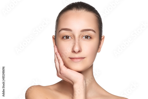 Tablou pe pânză Portrait of beautiful girl stroking her face with healthy skin