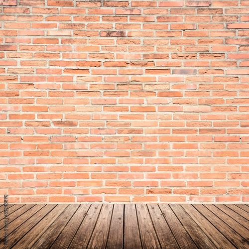 Old interior room with brick wall and wood floor