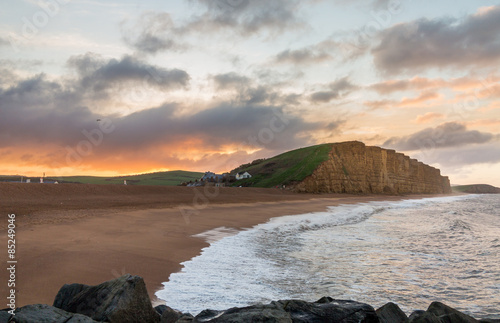 Sun rises at West Bay Dorset in UK