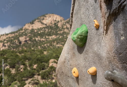 Climbing wall with mountains in background photo