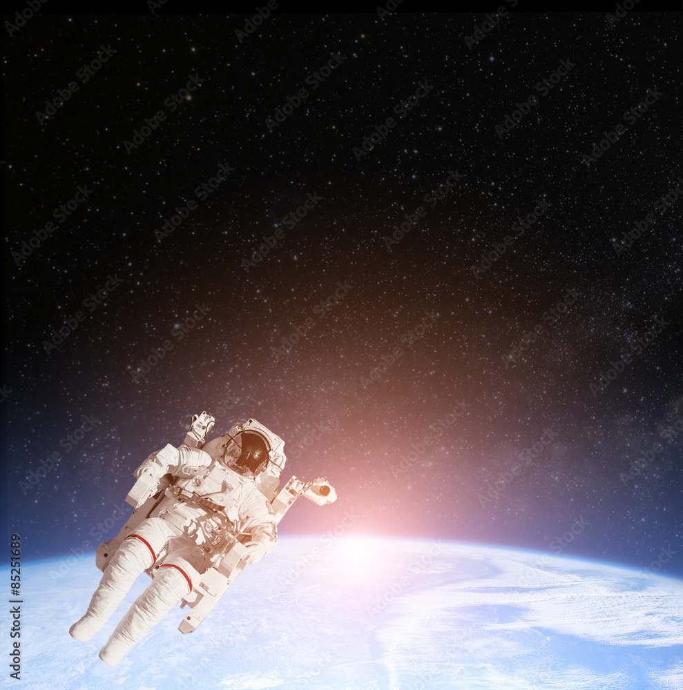 Astronaut in outer space against the planet earth. Elements of this image furnished by NASA. Astronaut in outer space against the planet earth. Elements of this image furnished by NASA.