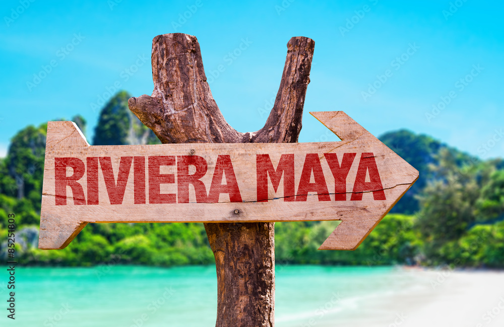 Riviera Maya wooden sign with beach background