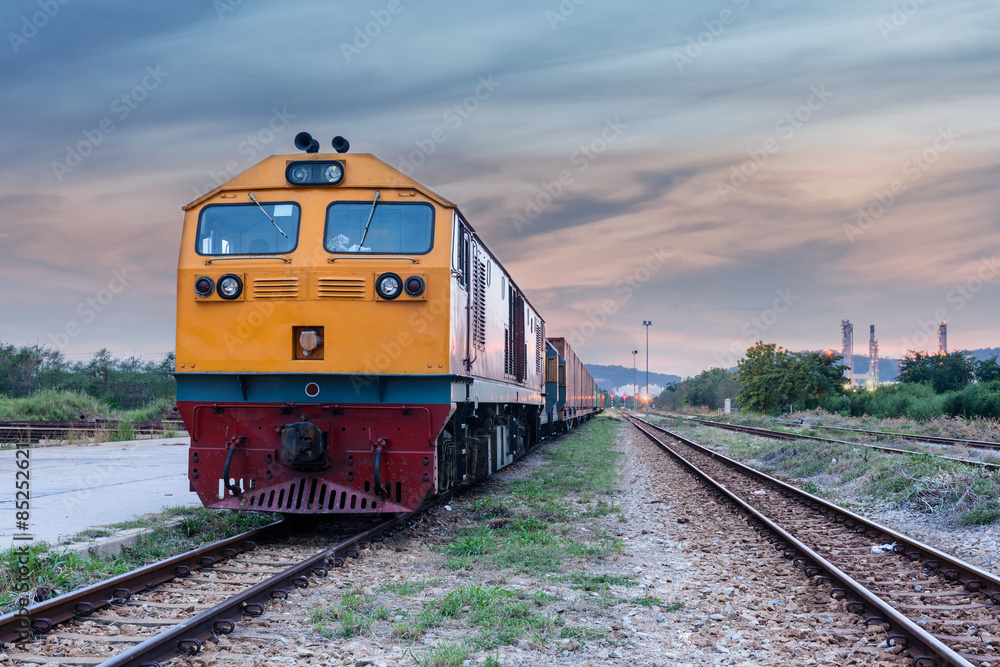 Cargo train and container at twilight Cargo train and container at twilight