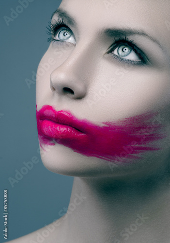 Pink lips paint line blue background Women Beauty