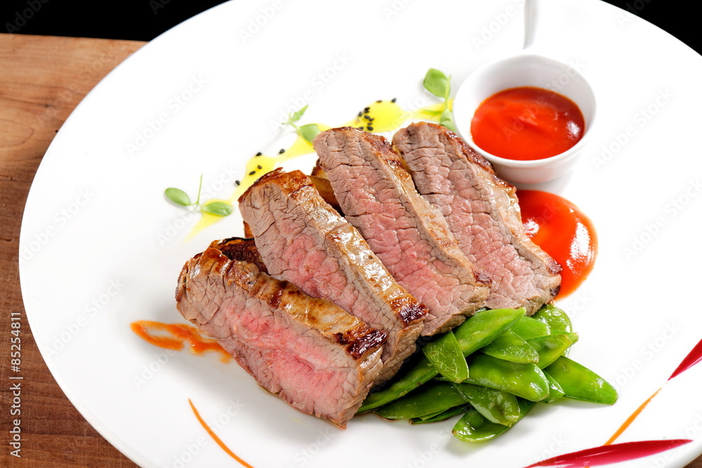 Roasted Kobe Marbled beef fillets with snow peas and tomato sauce