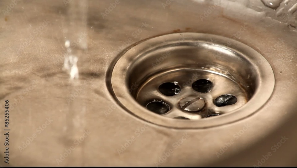 Close up of streaming water in kitchen sink Close up of streaming water in kitchen sink