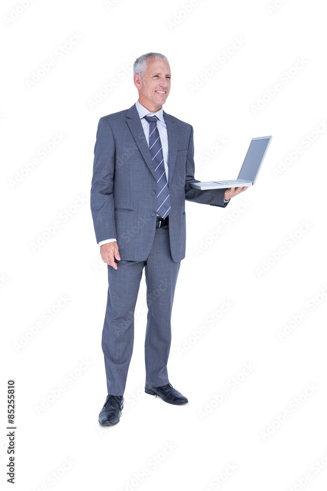 Happy businessman holding laptop computer Happy businessman holding laptop computer
