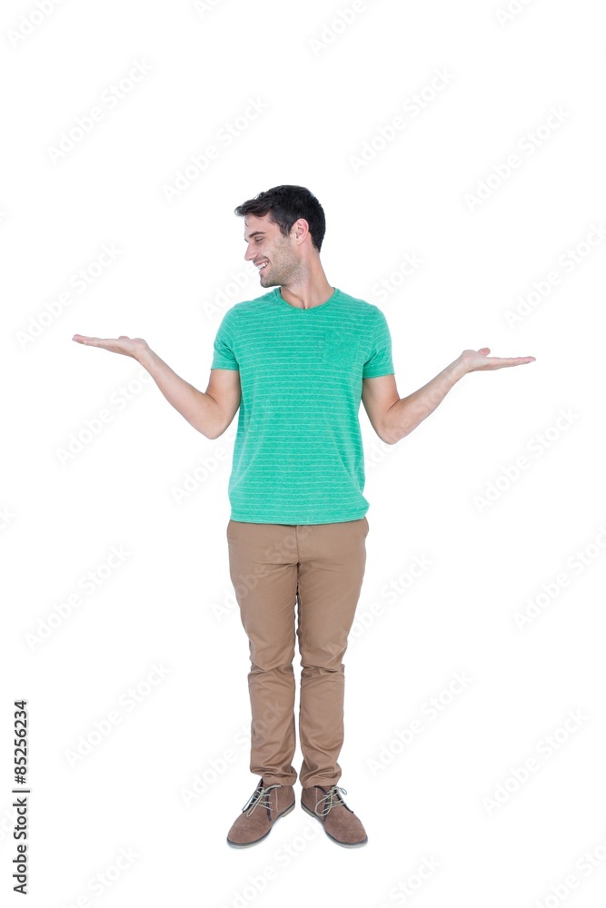 Handsome man showing something with his hands