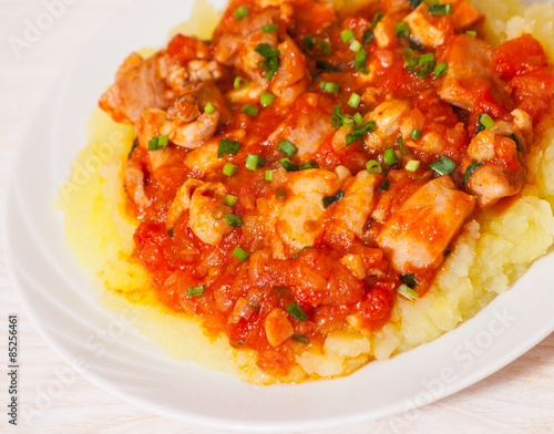 meat in tomato sauce with mashed potatoes