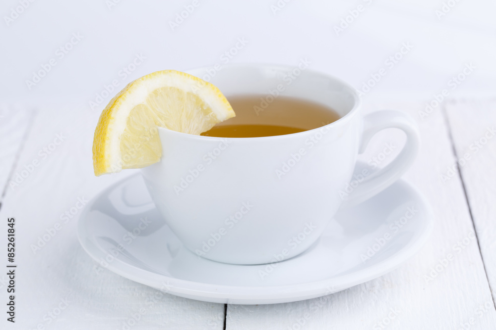 Green tea with lemon on wooden table. Green tea with lemon on wooden table.