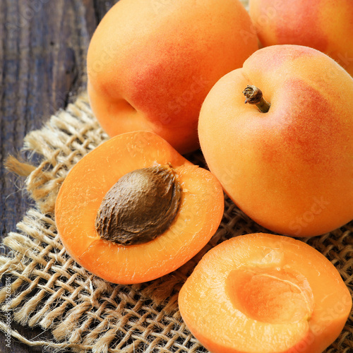 Fresh ripe apricots on a rustic wooden table