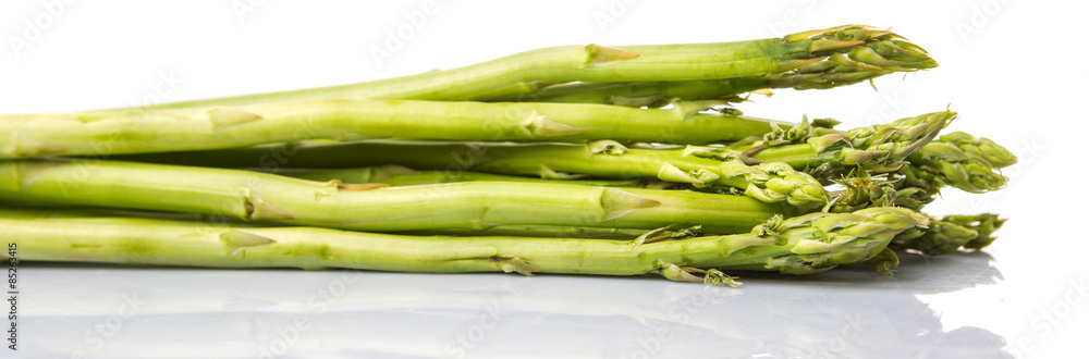Fresh green asparagus vegetable over white background Fresh green asparagus vegetable over white background