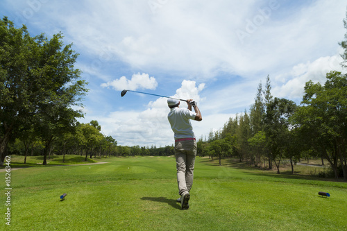 widely golf  course in very nice day summer with player