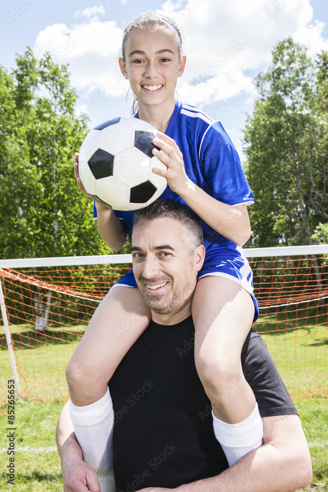 teenager girl with father play soccer teenager girl with father play soccer