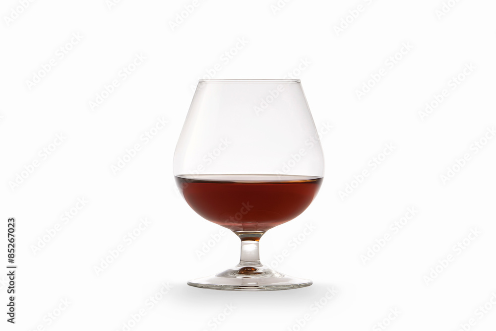 Cognac in glass isolated on white background Cognac in glass isolated on white background