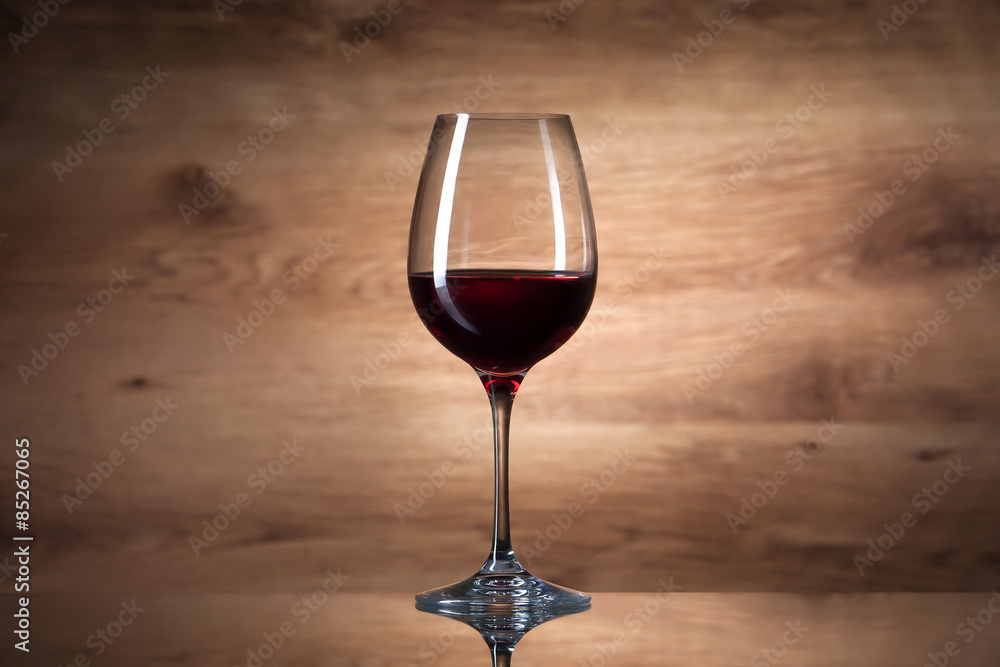 Wine. Wine glass on a wooden background