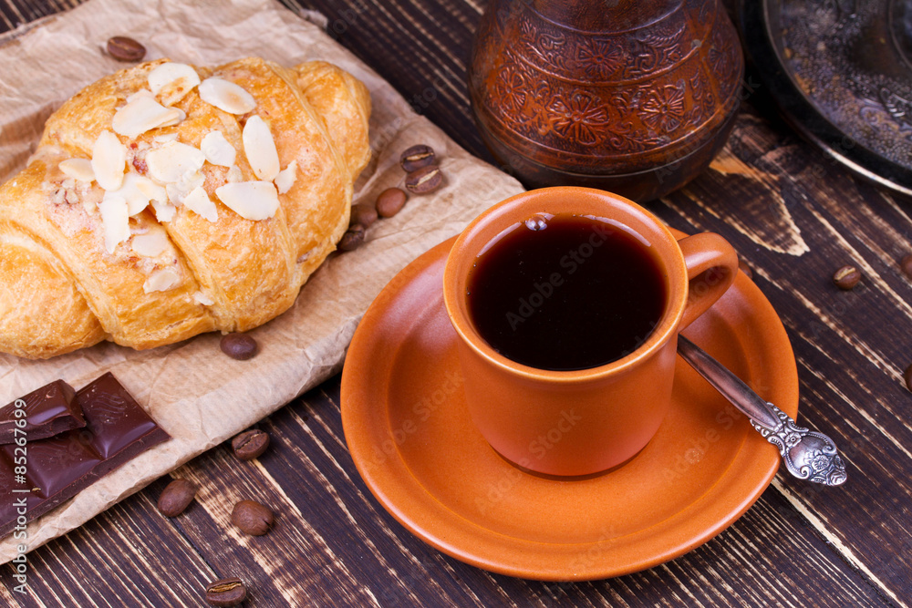 Coffee cup and croissant Coffee cup and croissant
