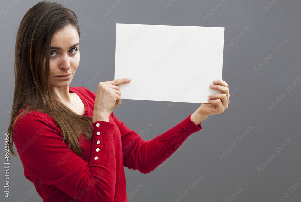 young woman looking serious holding a blank banner for presenting news on blank banner young woman looking serious holding a blank banner for presenting news on blank banner