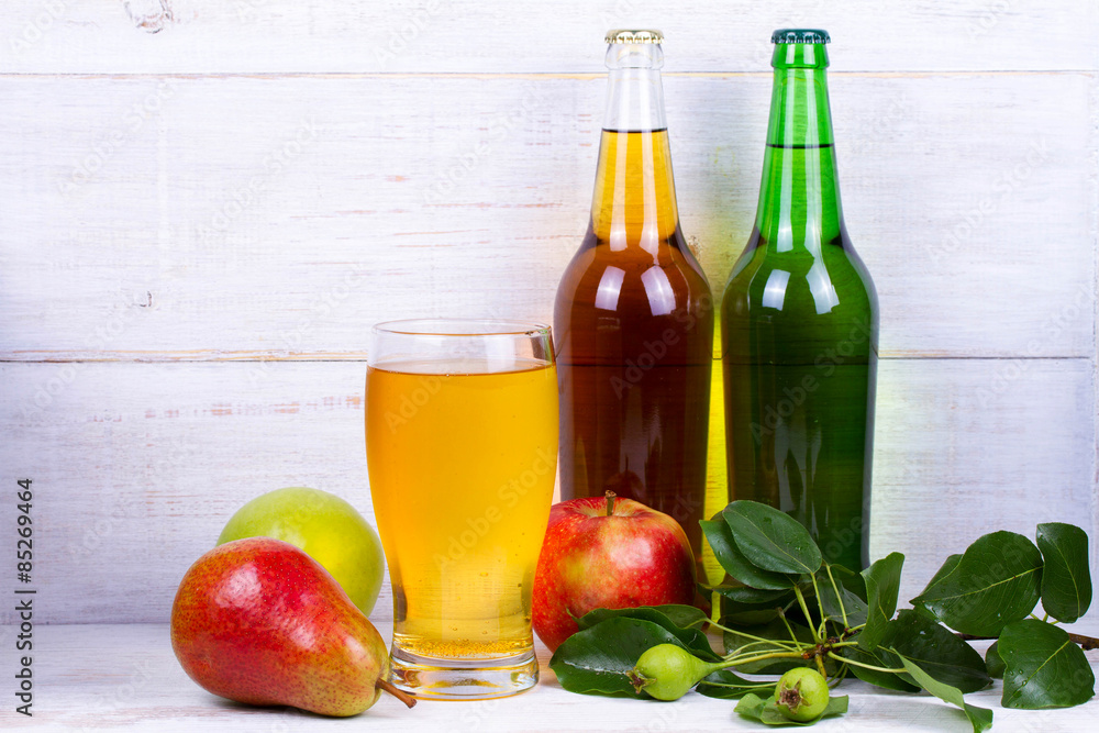 Glass and bottles of cider Glass and bottles of cider